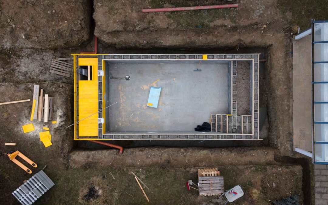 Aerial,Drone,Shot,Of,Construction,Site,From,Pool,With,Formwork